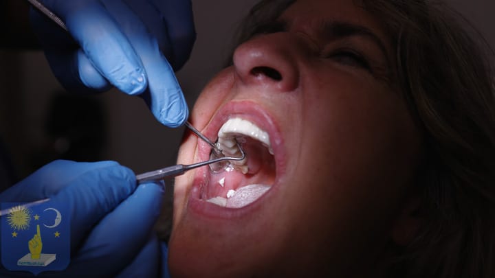 dentist placing a basal dental implant